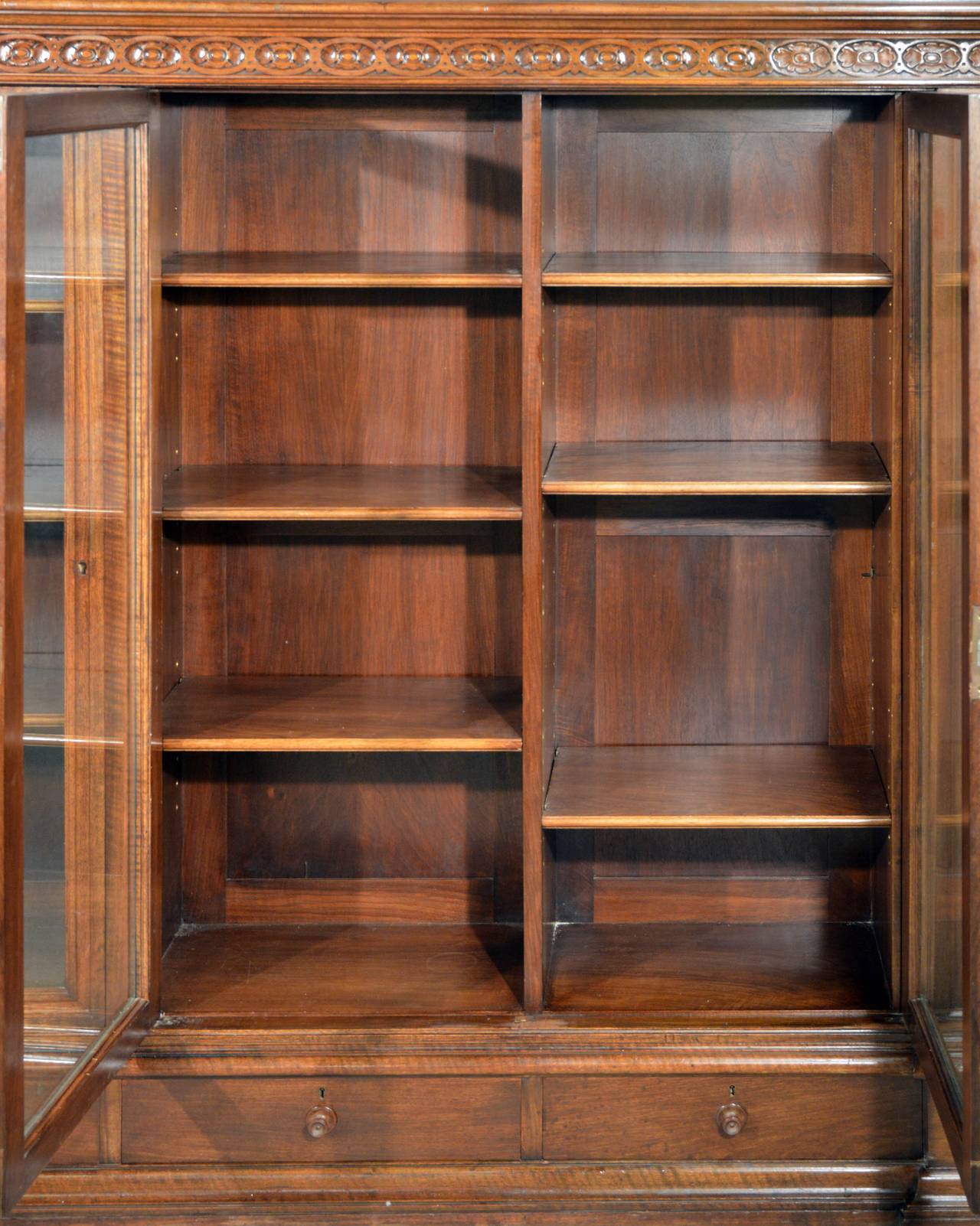 Gorgeous and substantial walnut American Renaissance Revival display case and cigar humidor, circa 1897. Drawers on bottom and hidden side cabinets. Left hidden case has galvanized zinc cabinet. Measures: 62