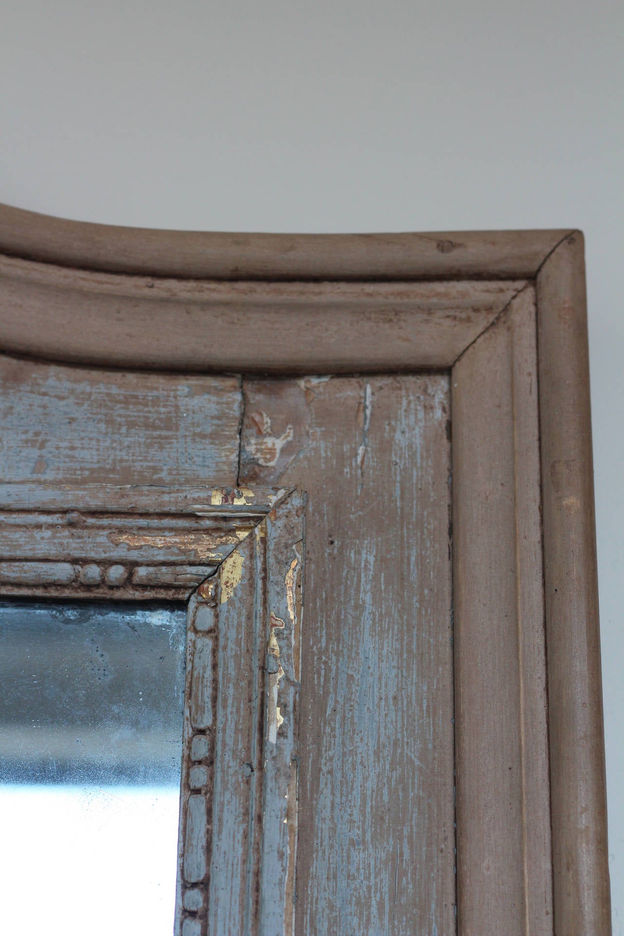 Lovely, carved trumeau mirror with original glass.  Some distressed areas in glass indicative of its age.