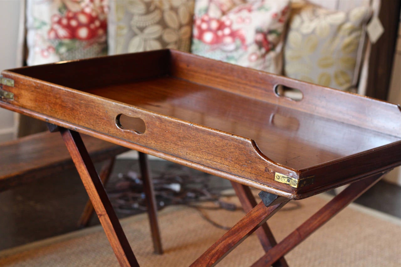Handsome butlers tray table made from beautiful mahogany with brass details.