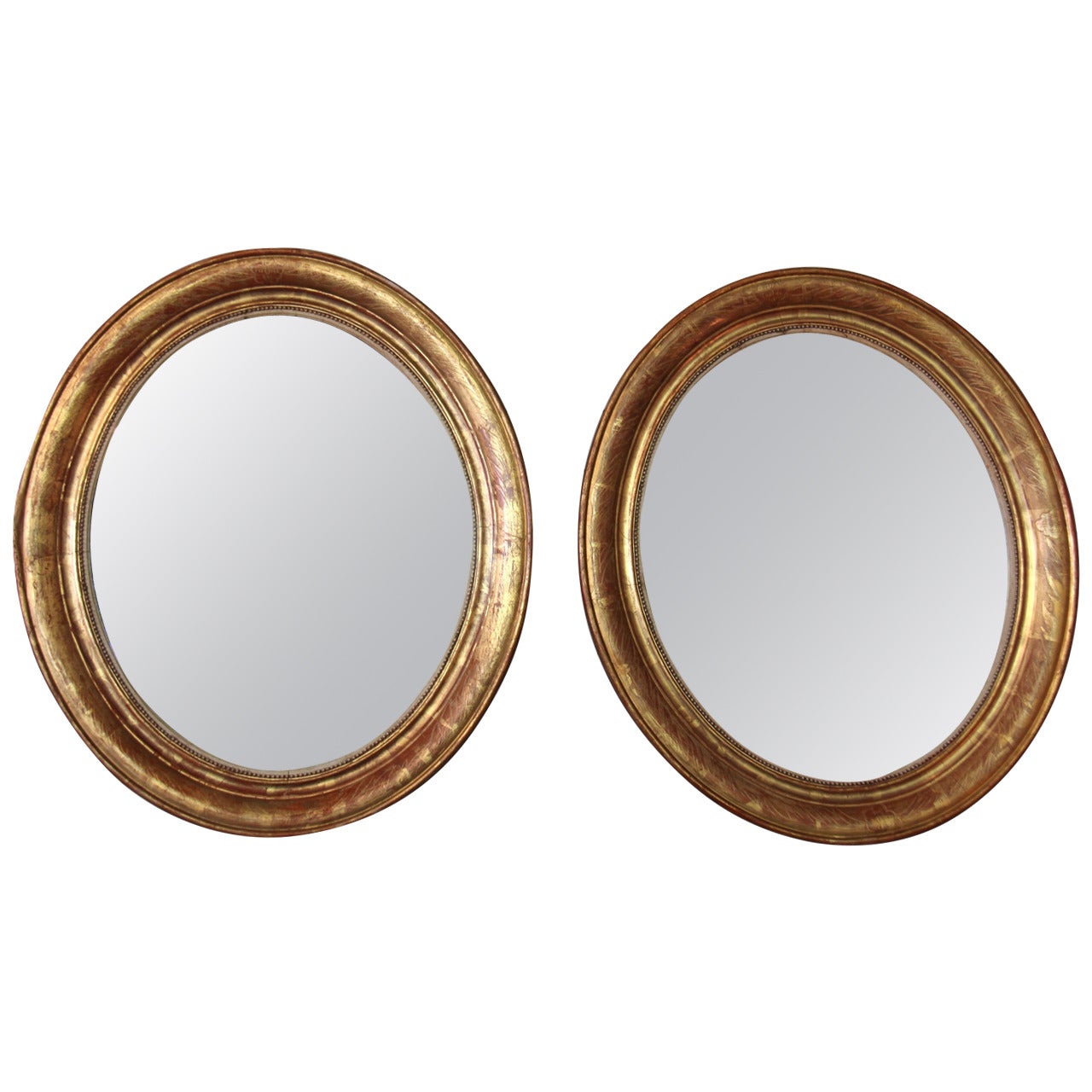 Pair of Oval Gilt Mirrors For Sale