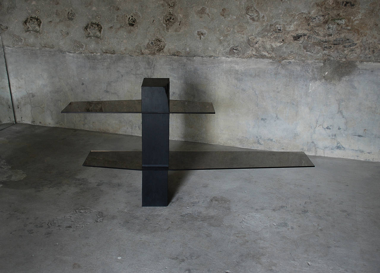 Adroit shelf
Frédéric Saulou. 
Materials: Trélazé black slate - gray smoked glass.
Dimensions: 90 x 157 x 35 cm.

Edition of 8.
Signed and Numbered.

“While wandering in the streets I have been observing buildings
construction toward