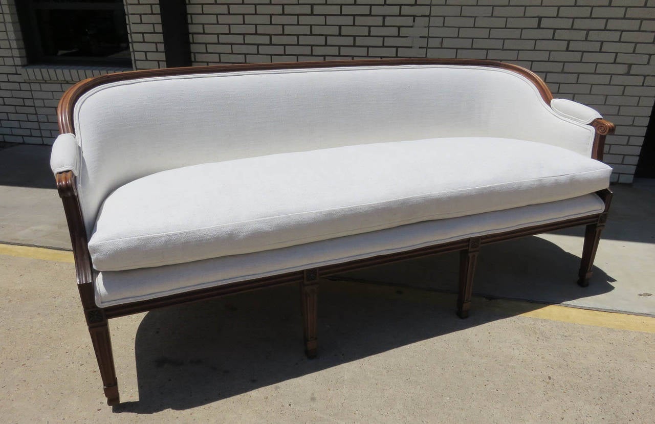 19th century Louis XVI canape in walnut, new upholstery.