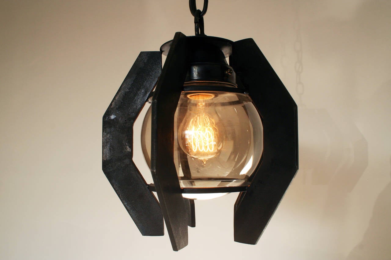 Industrial style pendant with steel that is burnt black in a forge. These pendants were designed with underwater mines in mind. Comes with 10 feet of burnt black chain, matching canopy and 60 watt Edison style bulb. UL listed. 100% made in Los