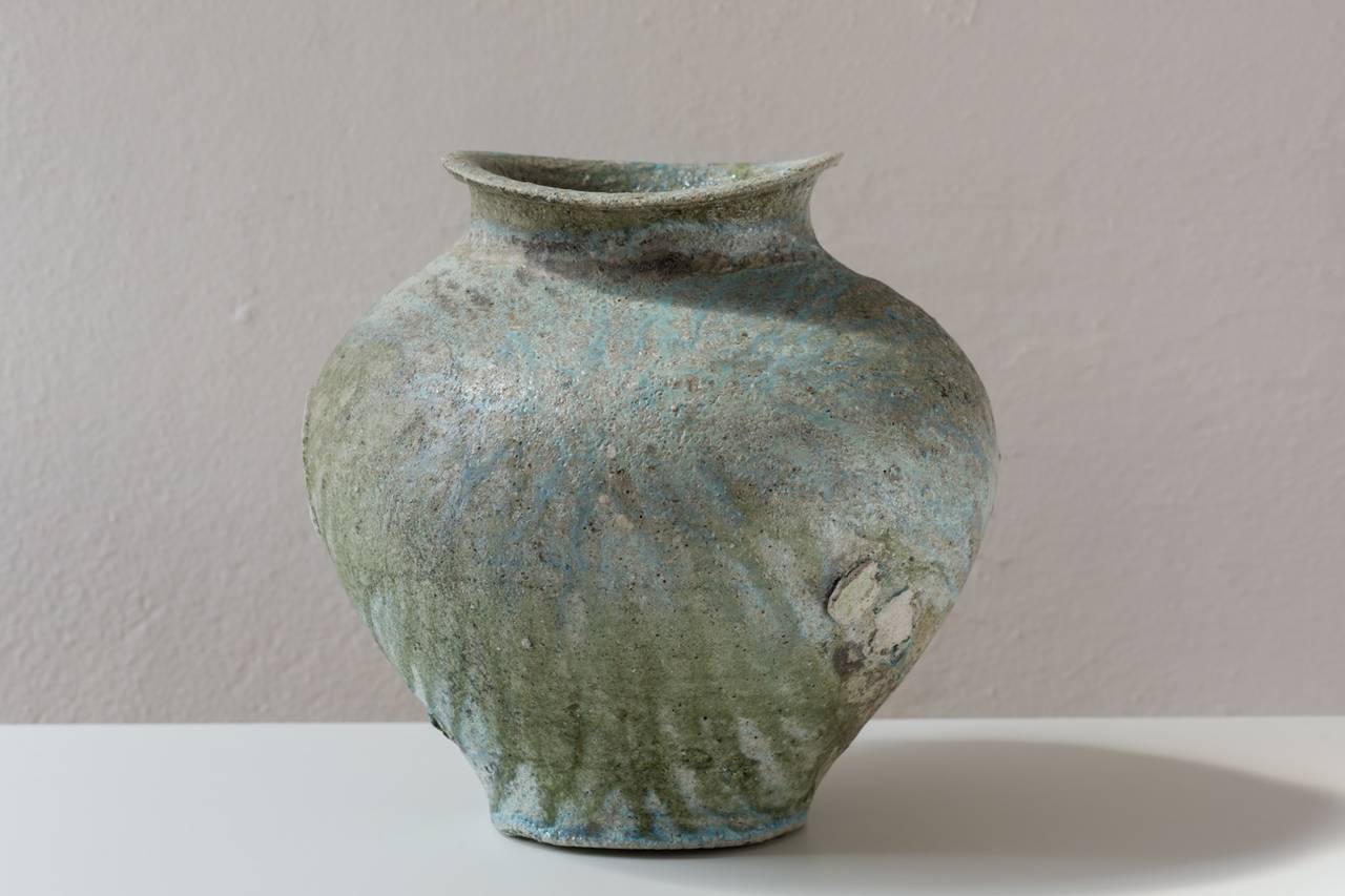 Yui Tsujimura’s style of pottery has one foot in the ancient Japanese style of pottery called Sue ware and makes it into his own.  The clay that he uses is his unique blend of Iga clay.  Tsujimura  fired this piece on its side  on several roundels. 