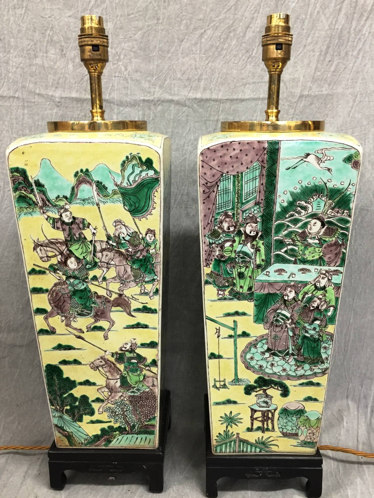 A very decorative pair of Chinese 19th century Famille Verte vases / lamps having classical garden scene on a yellow ground back ground.