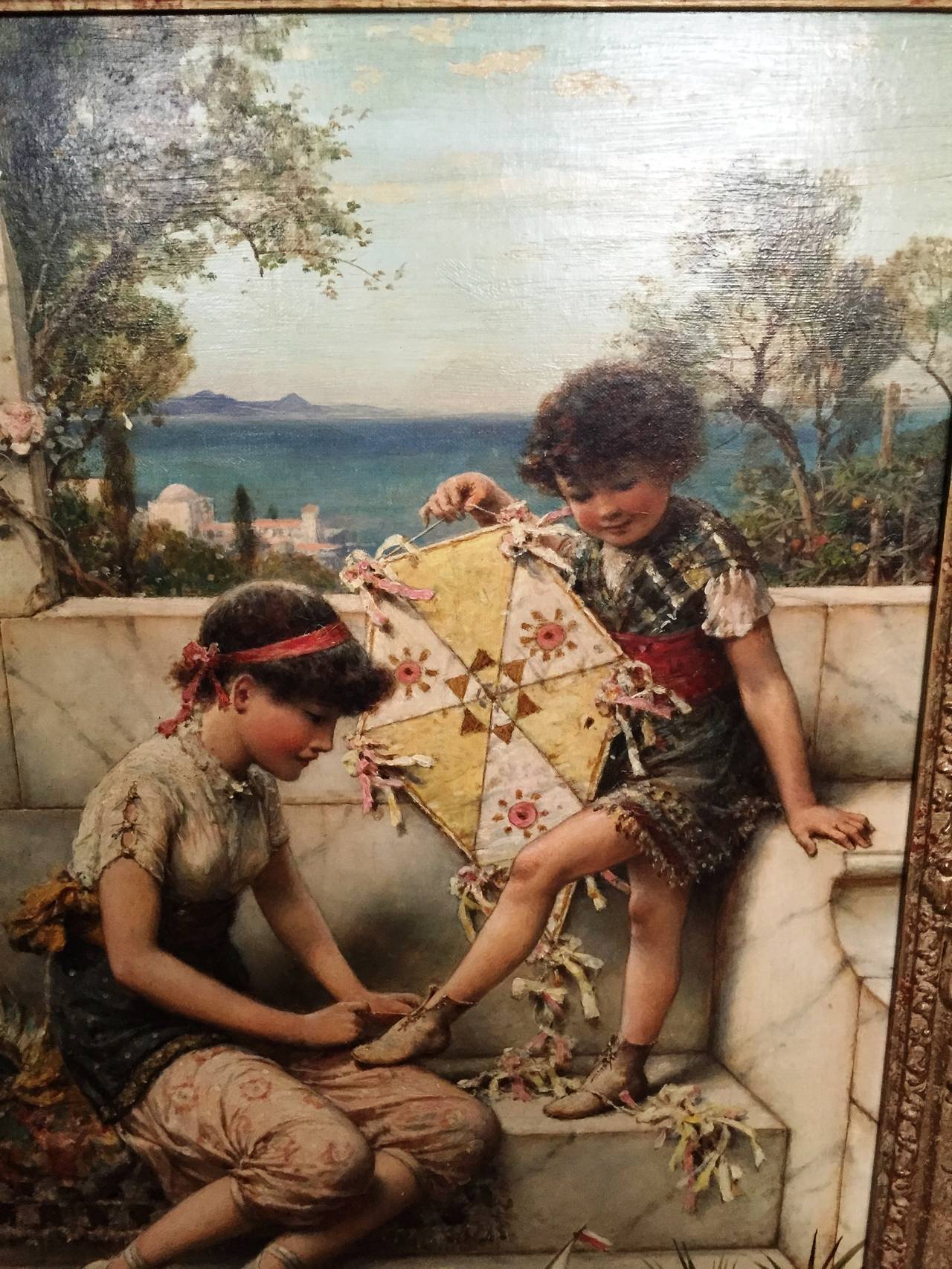 An enchanting oil on canvas painting of children with their toys. The older girl doing up the laces of the younger.
Signed W.S.Coleman
(1829-1904).