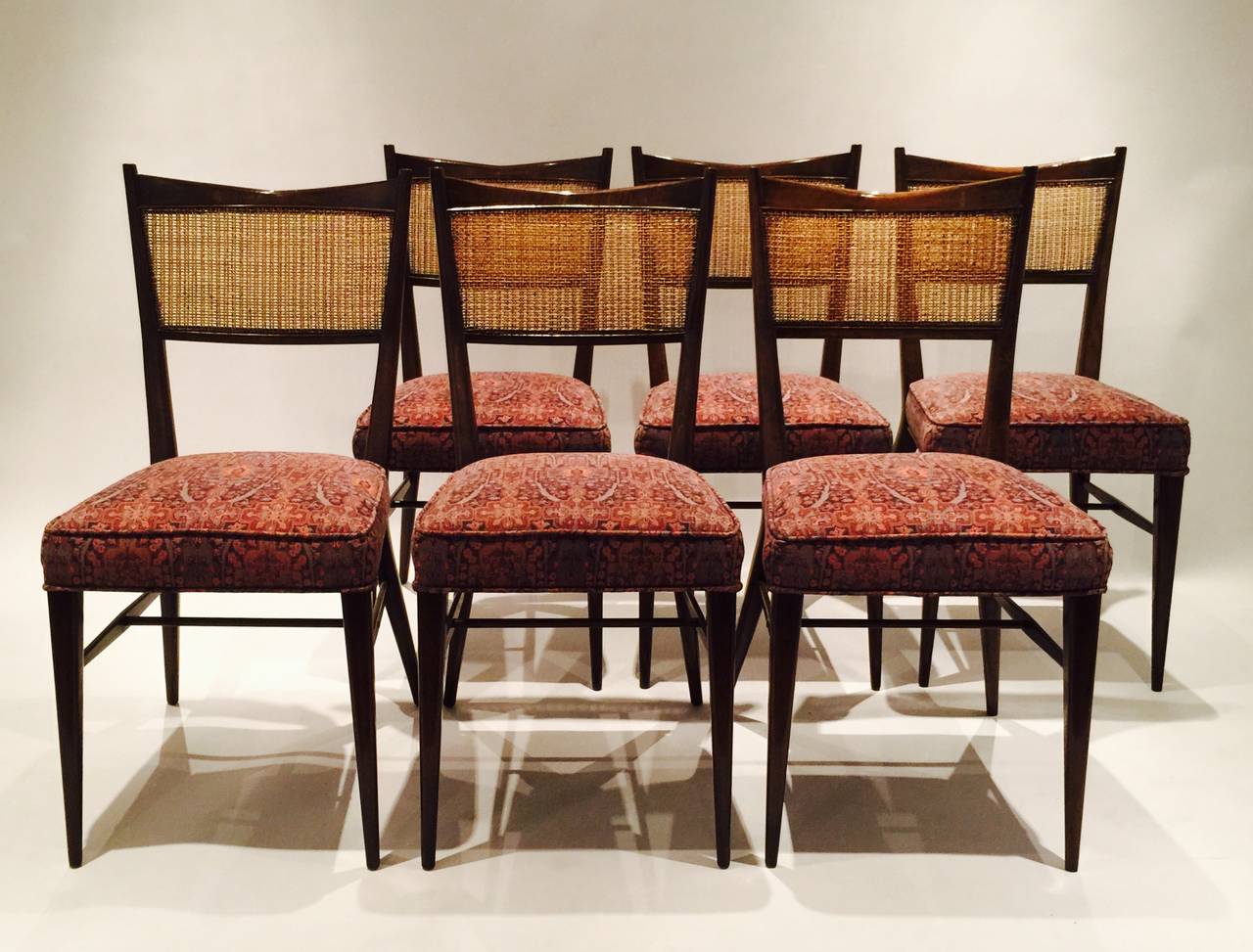 A Set Of Eight Paul McCobb Dining Chairs With Caned Backs.  Two Armchairs And Six Side Chairs.  Two Of The Side Chairs Appear To Be Matched. Dimensions Listed Are For The Armchairs Which Are Slightly Larger Than The Side Chairs.