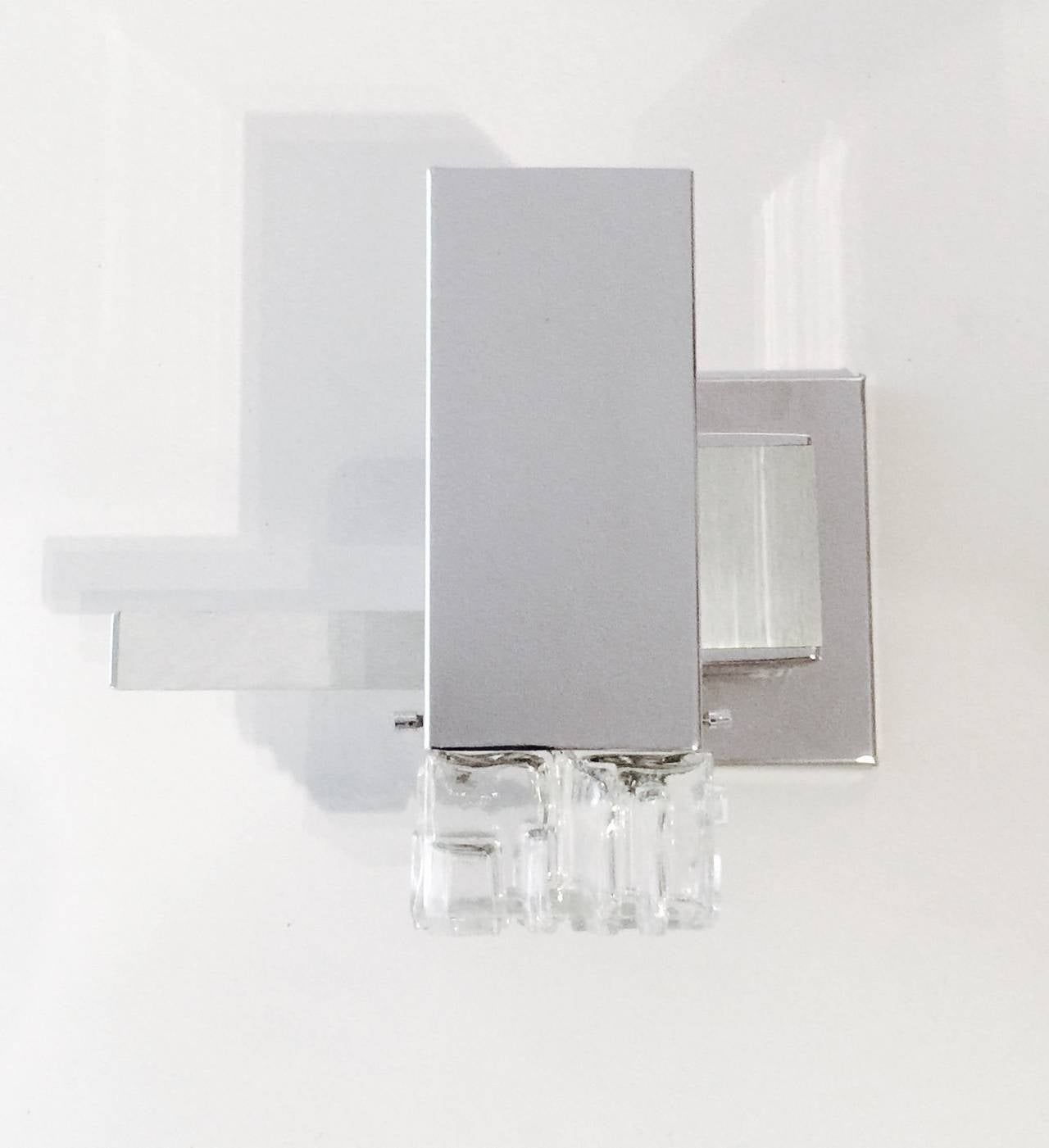 Three Chrome Plated Cubic Sconces With Brushed Aluminum Details And Clear Glass Shades