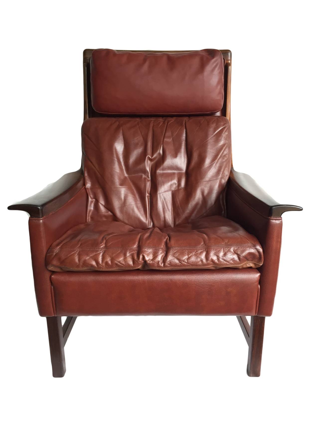 Rare Torbjørn Afdal wing armchair and ottoman.
Solid Brazilian rosewood and deep red leather.
Nesjestranda, Norway, 1960.