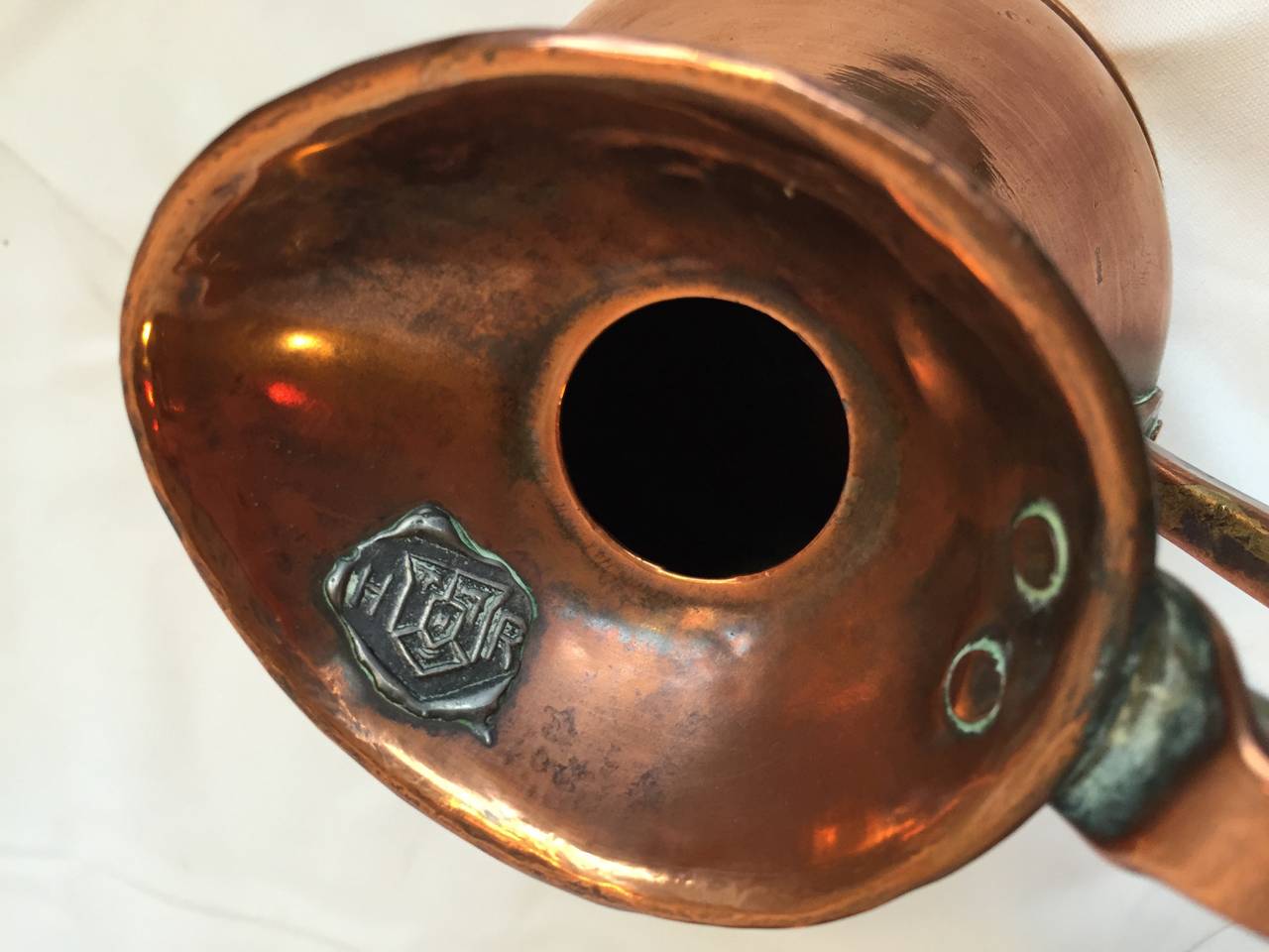 antique copper measuring jugs