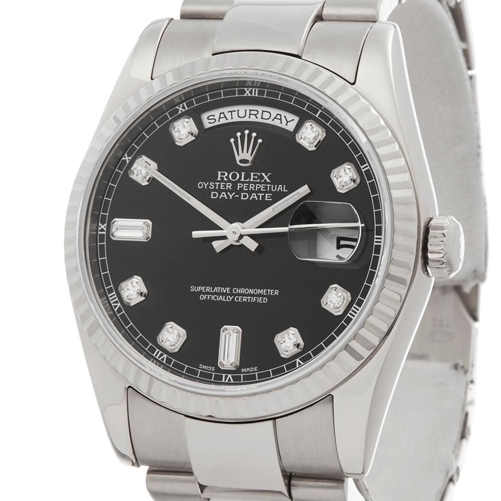 Contemporary 2000 Rolex Day-Date White Gold 118239 Wristwatch
 *
 *Complete with: Box Only dated 2000
 *Case Size: 36mm
 *Strap: 18K White Gold Oyster
 *Age: 2000
 *Strap length: Adjustable up to 18cm. Please note we can order spare links and