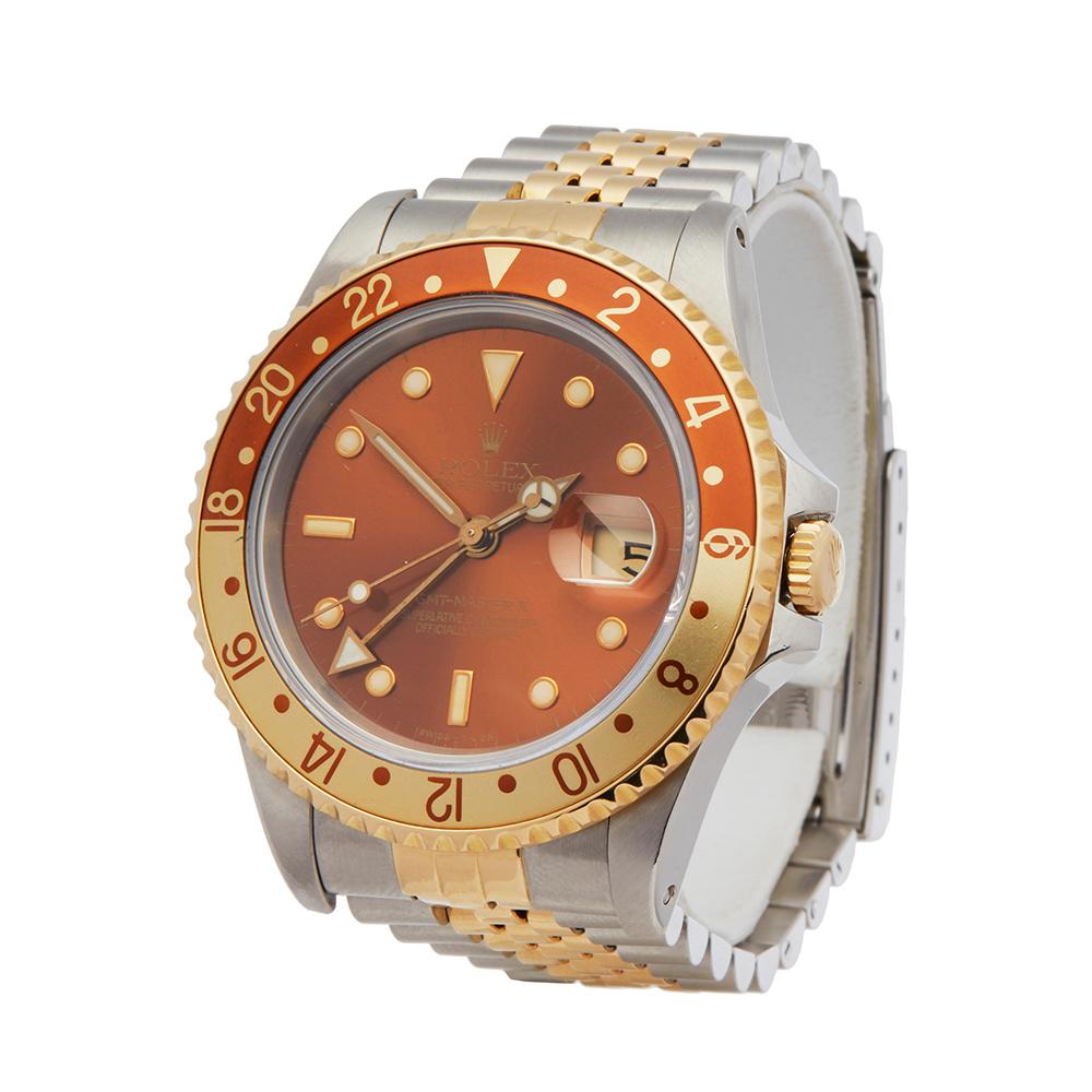 Contemporary 1990 Rolex GMT-Master II Rootbeer Steel & Yellow Gold 16713 Wristwatch
 *
 *Complete with: Box, Manuals & Guarantee dated 10th December 1990
 *Case Size: 40mm
 *Strap: Stainless Steel & 18K Yellow Gold
 *Age: 1990
 *Strap length: