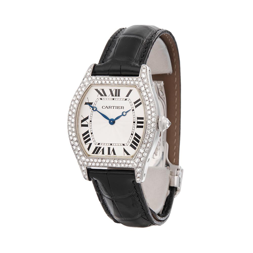 Contemporary 2009 Cartier Tortue White Gold WA503851 Wristwatch
 *
 *Complete with: Box, Manuals & Guarantee dated 29th December 2009
 *Case Size: 34mm by 43mm
 *Strap: Black Leather
 *Age: 2009
 *Strap length: Adjustable up to 20cm. Please note we