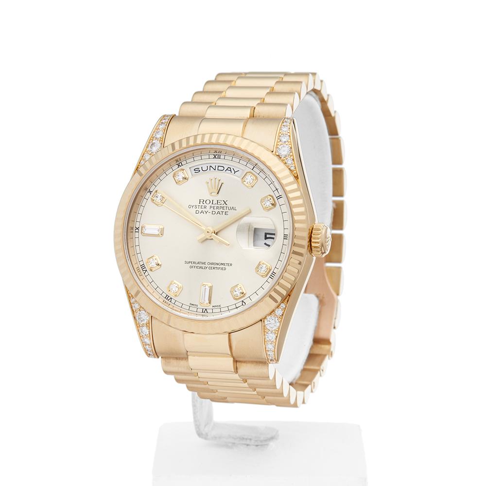 Contemporary 2001 Rolex Day-Date Yellow Gold 118338 Wristwatch
 *
 *Complete with: Box Only dated 2001
 *Case Size: 36mm
 *Strap: 18K Yellow Gold President
 *Age: 2001
 *Strap length: Adjustable up to 18cm. Please note we can order spare links and