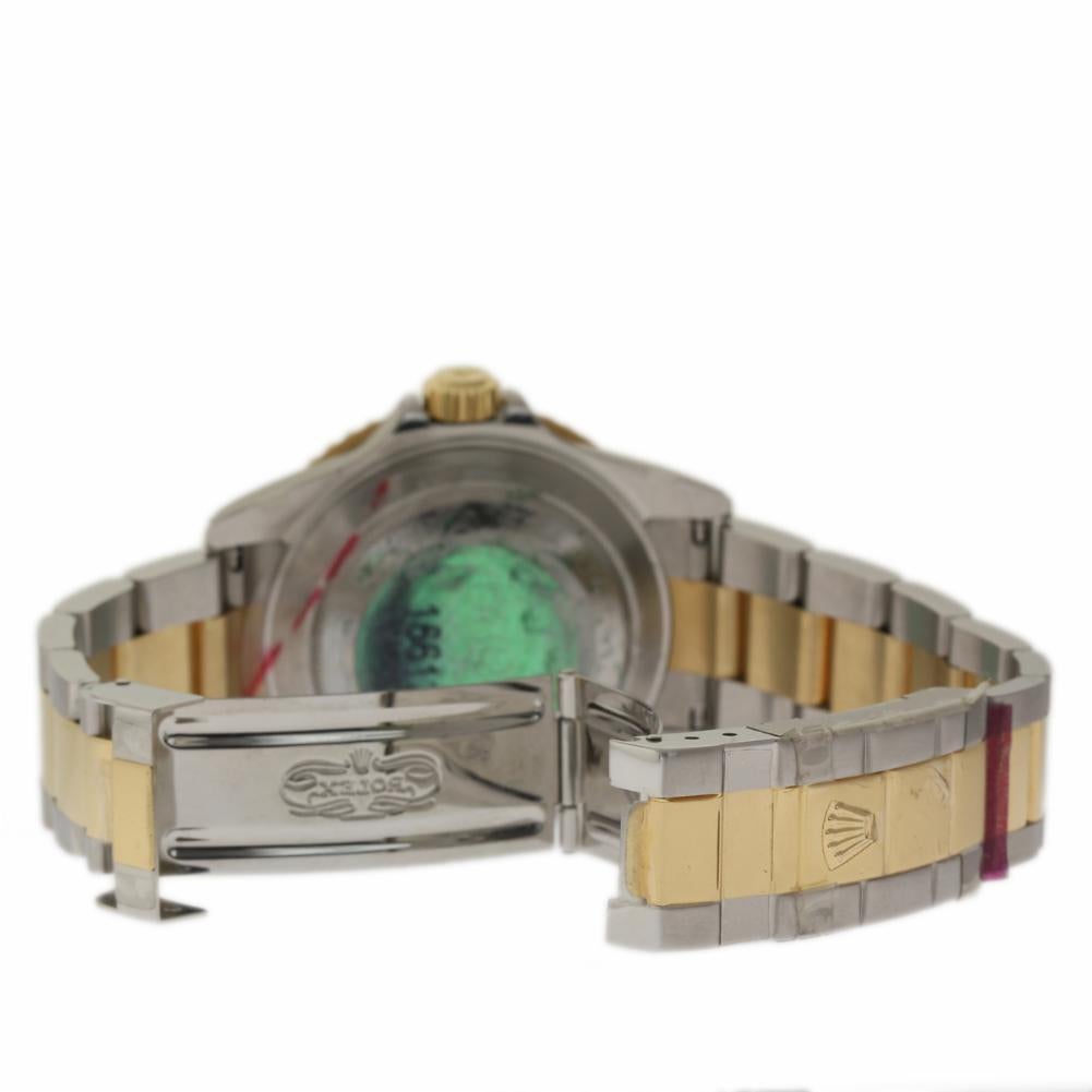 Rolex New Old Stock Submariner 16613 Steel Gold 2005 Box/Paper/Warranty #RL276 In Excellent Condition In Miami, FL