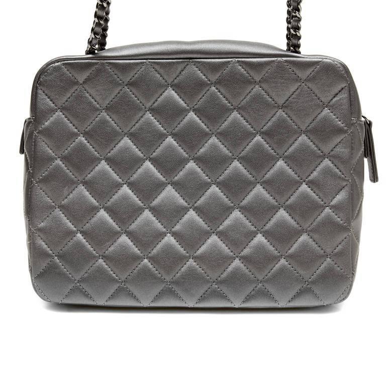 Chanel Evening Art Flap Bag- PRISTINE Runway Spring 2014 collection Very unique, the camera case style may be carried cross body or on the shoulder and works with nearly every color. Dark metallic pewter leather is quilted in signature Chanel