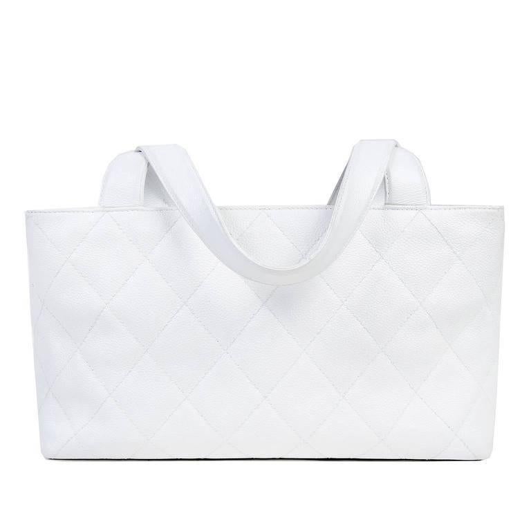 Chanel White Caviar Tote- EXCELLENT; appearing very rarely carried and carefully stored.
 A timeless piece that is certain to become a wardrobe favorite, this classic Chanel is a great find. Snowy white caviar leather is textured and durable.