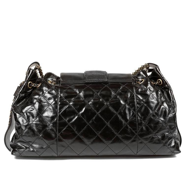 Chanel Black Calfskin and Stingray Jumbo Accordion Bag- Pristine Condition, appearing never carried. From the 2012 Bindi Collection, this piece features stingray accents on the flap and drawstring loops. Black glazed calfskin has a somewhat