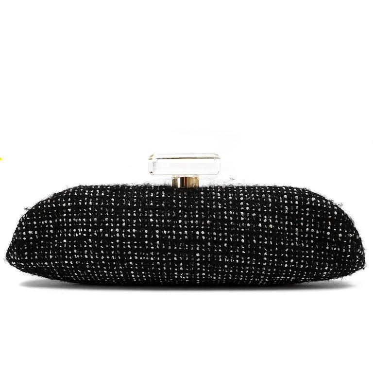 Chanel Black Tweed and Rhinestone Runway Clutch- Pristine Enhanced with ornate crystals and a Lucite clasp, this spectacular piece is a fantastic addition to any sophisticated collection. Black and white tweed wool blend is adorned with intricate