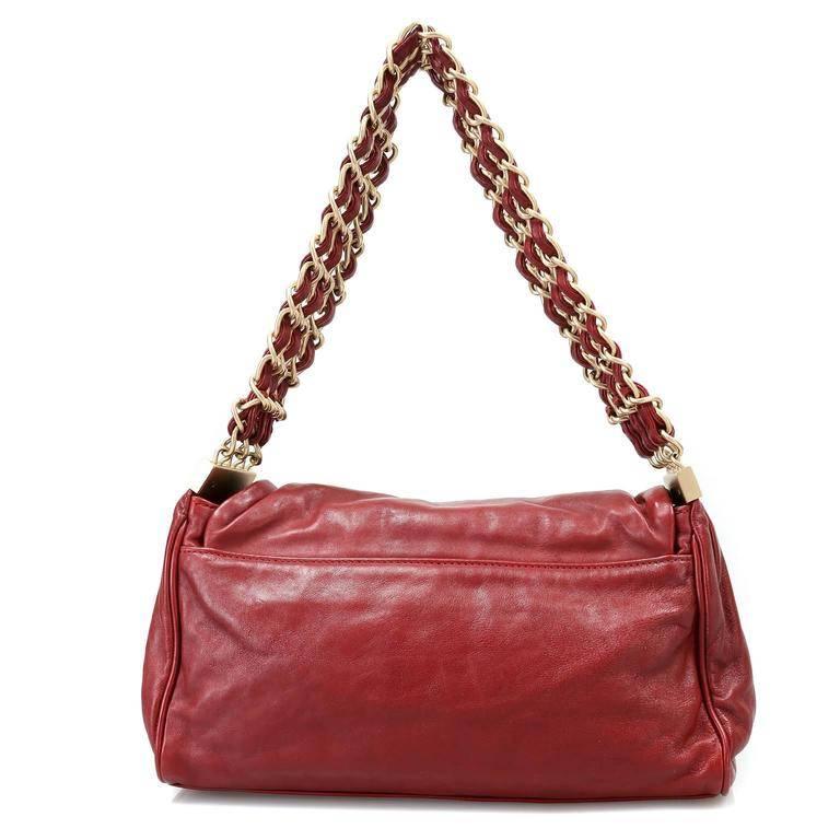 Chanel Red Lambskin Triple Chain Flap Bag- Nearly Pristine; no significant signs of prior ownership The classic style gets an edge from the unique triple chain strap which is comfortably worn on the shoulder. Lipstick red lambskin is stitched on the