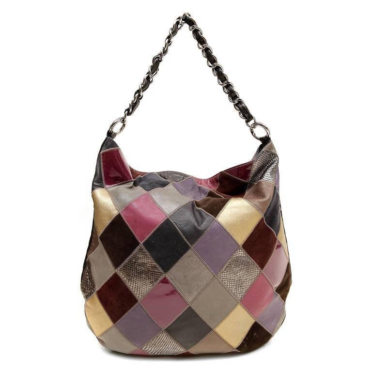 Chanel Multicolor Patchwork Hobo-  Good Vintage Condition The unique style combines texture and color brilliantly; perfect for everyday enjoyment. Suede, python, and leather patches are sewn together in a harlequin pattern. Neutrals, metallics and