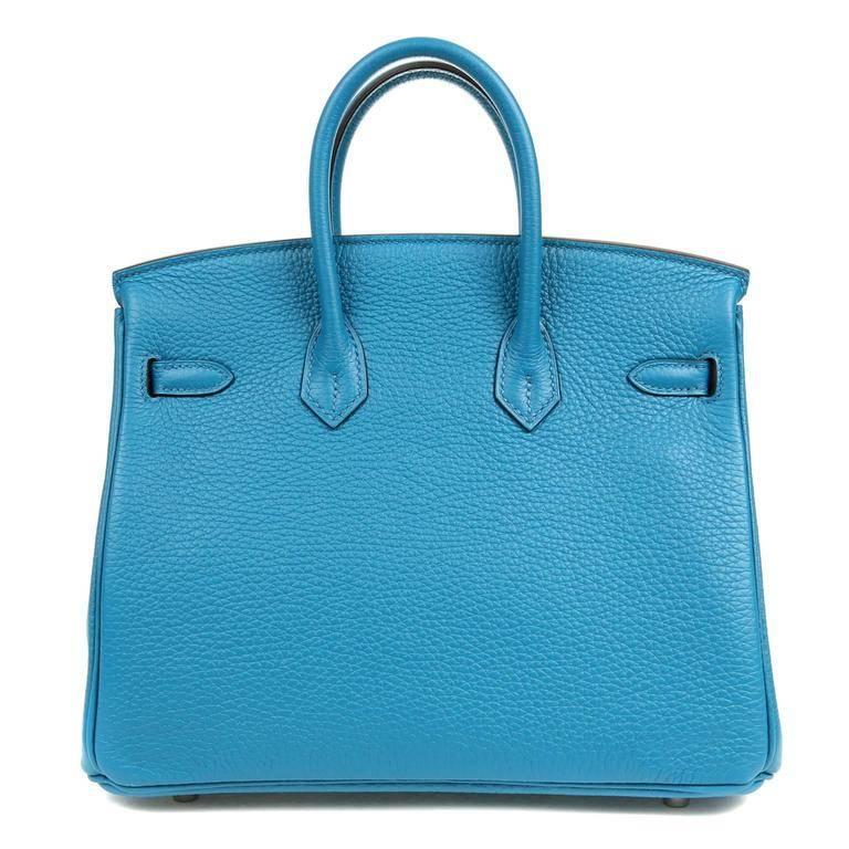 Hermes Blue Izmir Togo 25 cm Birkin- PRISTINE Never carried- the plastic is still on the Palladium hardware. The ultimate luxury item, each Hermes Birkin is hand sewn by skilled artisans. This Togo Birkin is textured and scratch resistant, known to