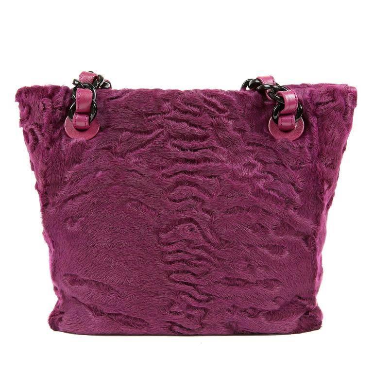 Chanel Purple Small Fur Tote - PRISTINE Pretty mulberry colored fur adds a beautiful pop of color to winter ensembles. Sheared astrakhan is plush and soft. Black resin chunky chain entwined with leather adds interest to the double straps. Leather