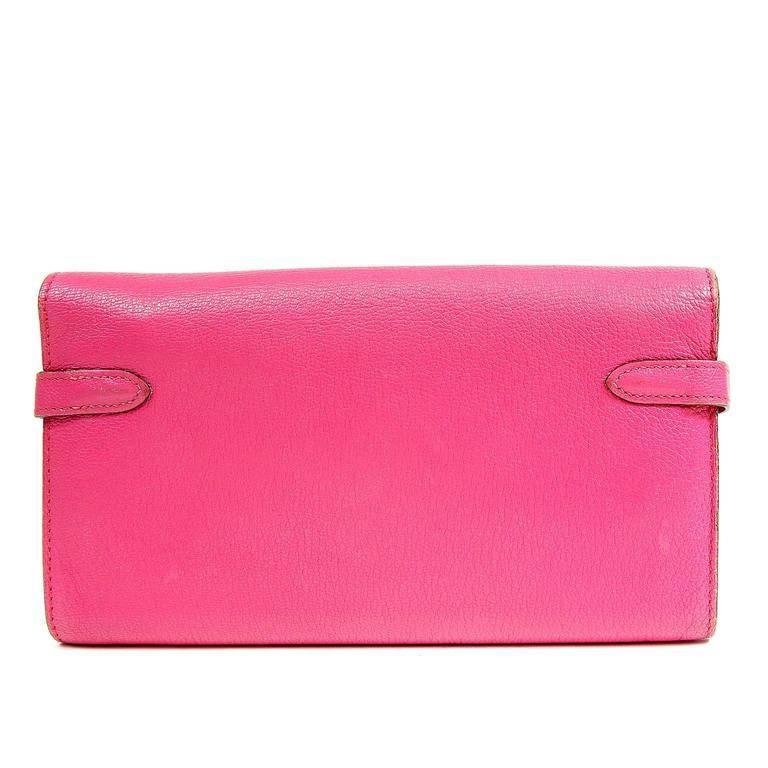 Hermes Fuchsia Chevre Kelly Wallet- Excellent Condition Hand sewn, this stylish wallet is extremely well designed for maximum practicality. Beautiful vivid pink chevre (goat skin) leather long Kelly wallet is textured and durable. Palladium swivel