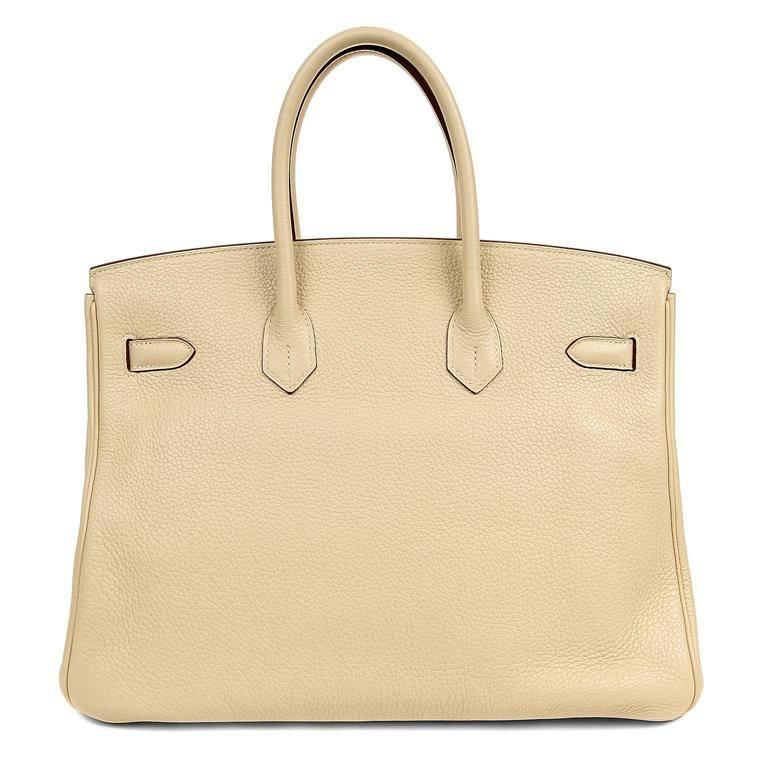 Hermes Parchemin Togo 35 cm Birkin Bag- PRISTINE; appears never carried. 
Waitlists exceeding a year are commonplace for the intensely coveted Birkin. Each piece is hand sewn by skilled artisans and represents the epitome of fashion luxury.