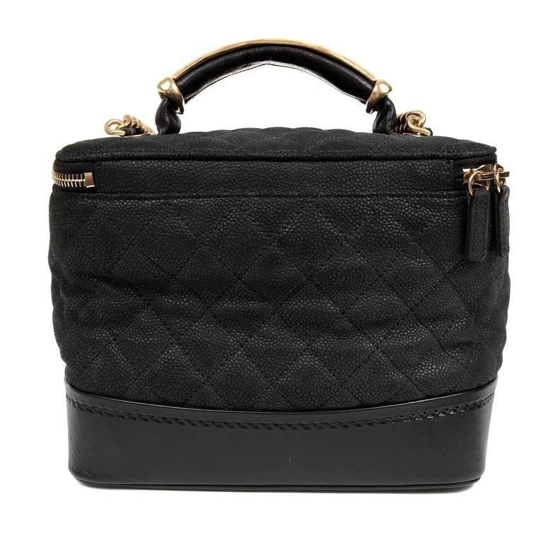 Chanel Black Leather Globetrotter Bag- PRISTINE The unique take on a cosmetic travel bag is both stylish and practical. Textured matte black caviar leather structured bag is quilted in signature Chanel diamond pattern. Smooth leather surrounds the
