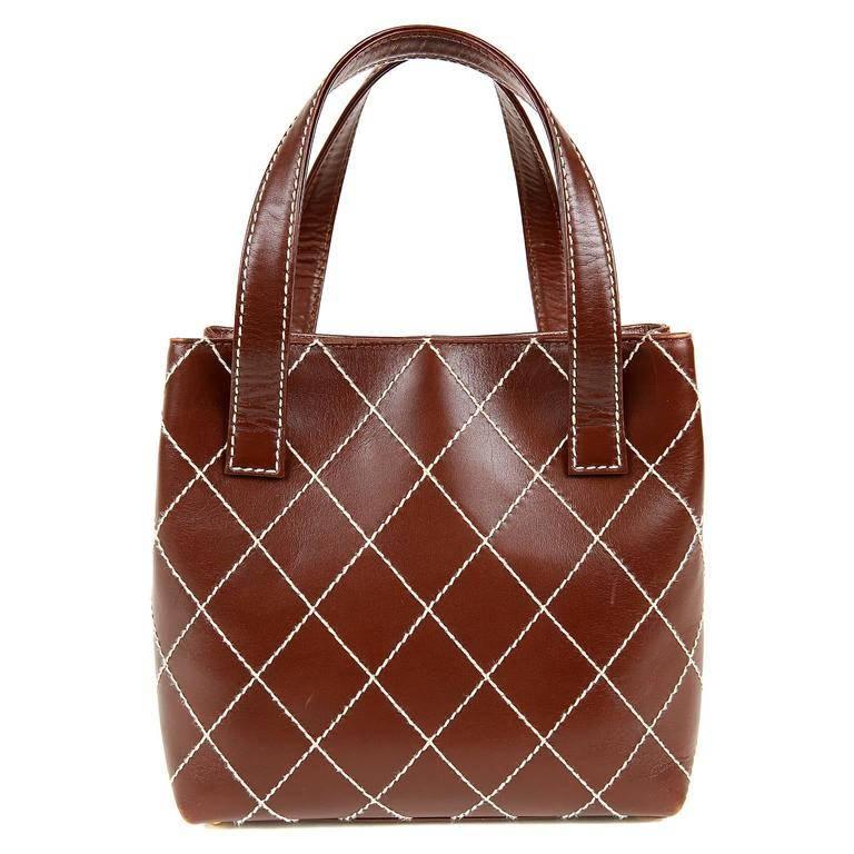 Chanel Brown Topstitched Day Bag- EXCELLENT Richly colored with contrasting stitching, it elevates an everyday bag to something special. Russet brown leather is topstitched in signature Chanel diamond pattern with contrasting ivory thread. Subtle