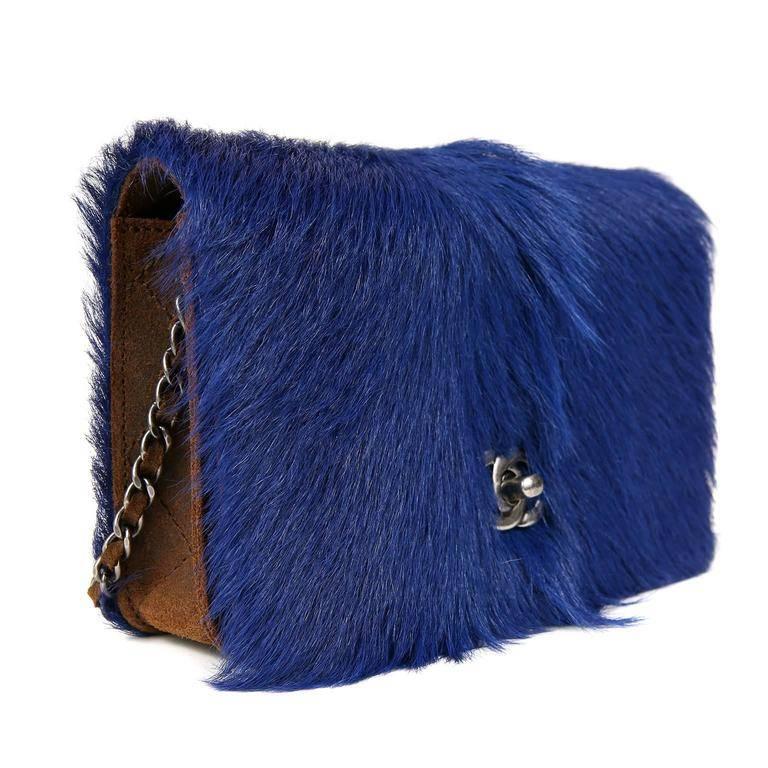 Chanel Blue Fur Wallet on a Chain- PRISTINE From the 2013 Paris- Edinburgh Runway collection, this stand out piece is a must have for collectors. Nearly neon blue goat fur combines beautifully with distressed brown leather which surrounds the sides,