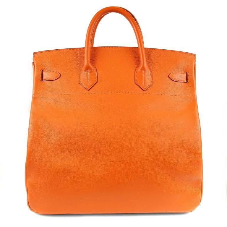 Hermes Orange Epsom Leather 40 cm HAC- Pristine Condition Considered the ultimate luxury item the world over and hand stitched by skilled craftsmen, wait lists of a year or more are commonplace for Hermes bags. The HAC is very similar to the Birkin