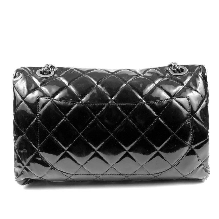 Chanel Black Patent Leather XXL Reissue Bag- PRISTINE It is particularly rare in the oversized silhouette with ruthenium hardware. Glossy black patent leather is quilted in signature Chanel diamond pattern. Ruthenium mademoiselle twist lock secures