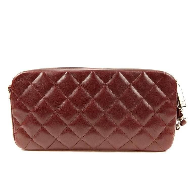Chanel Burgundy Leather Pocket Camera Bag is pristine, appearing never carried. Easily transitions from day to evening, this versatile piece also adds subtle color to any ensemble. Deep burgundy leather is quilted in signature Chanel diamond