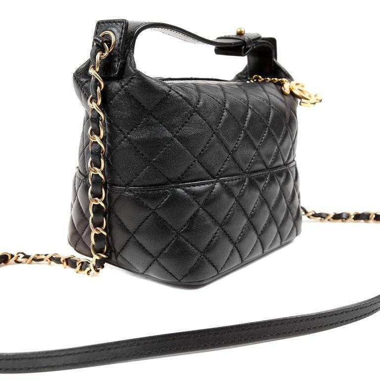 Chanel Black Leather Crossbody- Pristine Condition The versatile small bag easily transitions from day to evening. Black leather is quilted in signature Chanel diamond pattern. Zippered top has large gold interlocking CC pull. Black fabric interior.