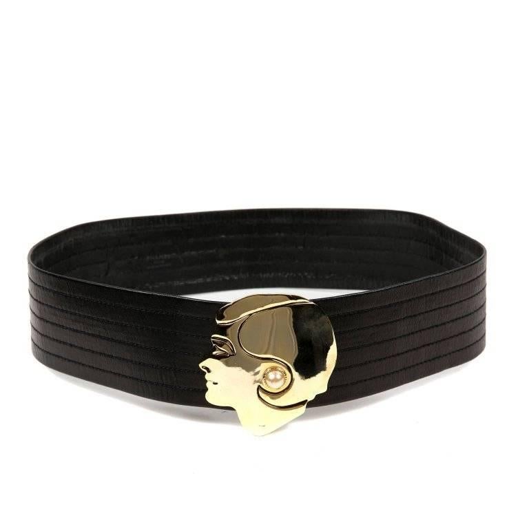 Chanel Black Leather Gold Face Belt- Excellent Condition Black leather stitched belt with a stunning gold woman face in profile for the buckle. Adorned with a pearl earring. 