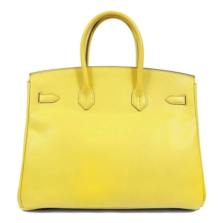 This authentic Hermes Soufre Epsom 35 cm Birkin is in pristine condition. Considered the ultimate luxury item, the Hermes Birkin is stitched by hand. Waitlists are commonplace. Soufre is a bright yellow pop of color that maintains a sophisticated