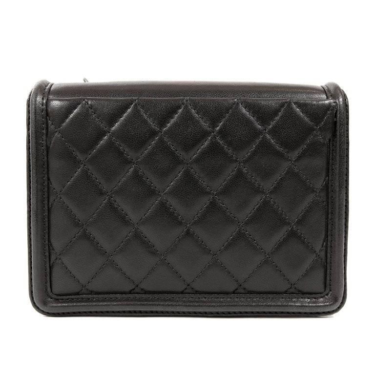Chanel Boy Brick Flap Bag in Black- Pristine condition
 From the 2013 collection, the edgy Brick is the perfect companion for evening or daytime hands-free wear. 
Black structured leather small flap bag has ruthenium interlocking CC adorning the