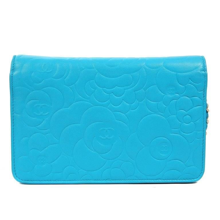 Chanel Turquoise Leather Camellia WOC- PRISTINE; Never Before Carried The brilliant design of the Wallet on a Chain (WOC) makes it a favorite style for any Chanel lover. Cheerful turquoise leather is embossed with camellia flower pattern. Soft gold