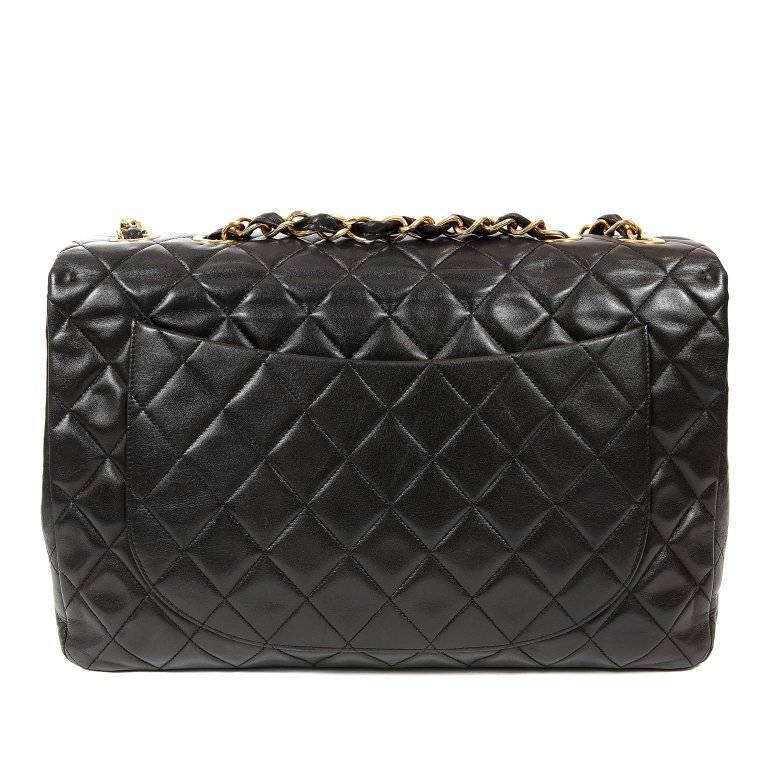 Chanel Black Lambskin Classic Maxi Flap Bag- EXCELLENT Vintage Condition The largest size classic with a single flap and oversized CC twist lock, the Maxi is a very desirable piece for collectors. Soft black lambskin is quilted in signature Chanel