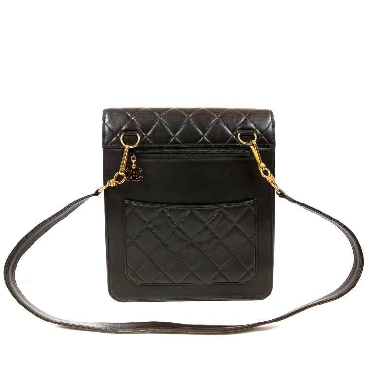Chanel Vintage Black Leather Compartment Day Bag- Pristine condition, appearing never carried. The striking style is unisex and perfect for every day enjoyment. Black lambskin flap style bag has a quilted upper flap with double snap closure. A