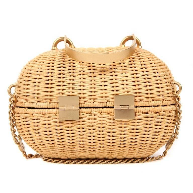 Chanel Wicker Love Basket Bag - Pristine Extremely rare and collectible piece. The very unique style is in pristine condition. Oval shaped small bag in woven wicker basket design. Matte gold hardware accents. Heart shaped clasp swivels to unlock.