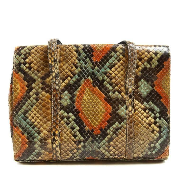 Chanel Multi Colored Python Mini Bag- Excellent Plus The rare exotic has beautiful colors and adds a unique pop to any ensemble. Python small flap bag has a melange of rich colors: beige, brown, green and orange. Large interlocking CC stitched
