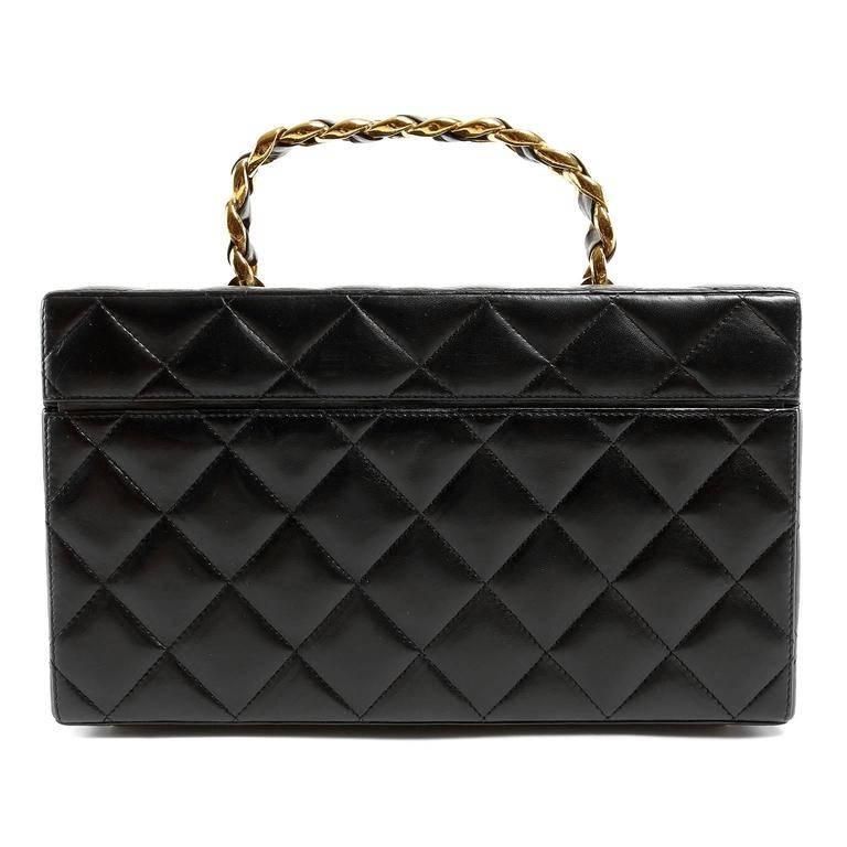 Chanel Black Leather Travel Case- PRISTINE A truly collectible piece, this style is rarely found in such exquisite condition. Structured box case is crafted in quilted black leather. Gold interlocking CC twist lock closure. Burgundy leather interior