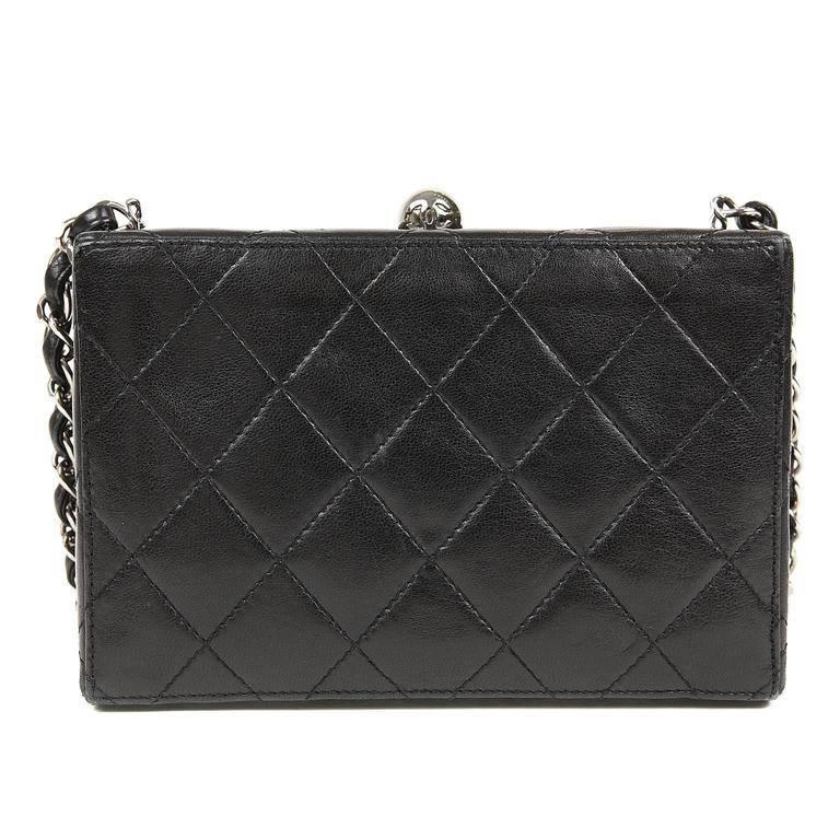 Chanel Black Lambskin Mini Box Bag- EXCELLENT
 The perfect companion for evening, this petite purse carries just the essentials. Black structured box bag in quilted lambskin. Hinged opening with silver ball clasp. Clean black leather interior.