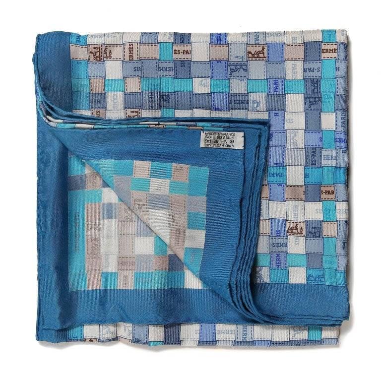 Hermes Blue Bolduc au Carre 90 cm Silk Scarf- PRISTINE, Never Worn Designed by Cathy Latham, it depicts interwoven decorative Hermes ribbon in shades of blue with beige accents. 100% silk. Made in France. Hermes box included. 