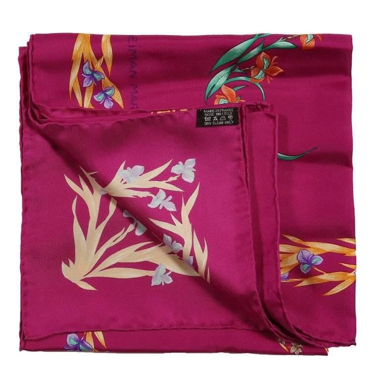 This authentic Hermes Cheval Fleuri 90 cm Silk Scarf is pristine. A Limited Edition reissued in 2007 to commemorate the 100th anniversary of Neiman Marcus, originally issued in 1962 and designed by Henri d'Origny. Fuchsia background with turquoise