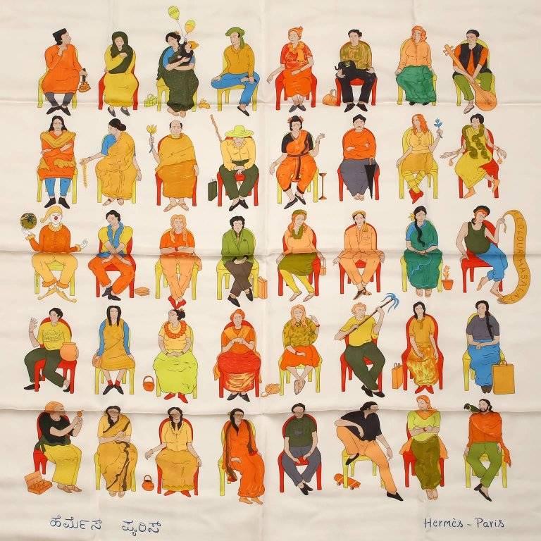 This authentic Hermes Colour Masala 90 cm Silk Scarf is pristine. Designed by N.S. Harsha and issued in 2008. White background with chartreuse border and orange accents. Pattern motif features a spicy blend of colorful people sitting in chairs