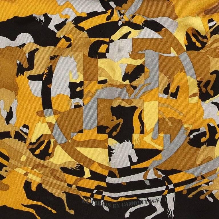 This authentic Hermes Ex Libris en Camouflage Pochette Silk Scarf is new. Issued in 2010/ 2011 and designed by Benoit Pierre Emery. Black background and camouflaged signature Ex Libris carriage and groom pattern in shades of gold. Made in France.